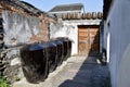 Large black rice wine jars in a courtyard in Wuzhen, Tongxiang, China. Royalty Free Stock Photo