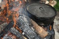 Large 16 Sixteen inch Lodge Camp Dutch Oven Sits in the Fire Royalty Free Stock Photo