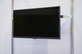 A large black TV screen on a white wall