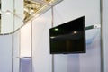 A large black TV screen on a white wall