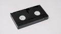 Large black vhs videocassette on white background, back side Royalty Free Stock Photo