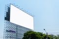 Large blank billboard located on the side of the road with clear sky background Royalty Free Stock Photo