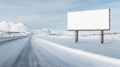 Large blank billboard is standing beside a snowy road with mountains in the background, offering lots of copy space Royalty Free Stock Photo