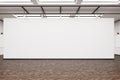 Large blank wall in an art gallery with dark wood floor Royalty Free Stock Photo