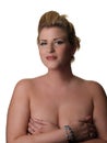 Large blond woman with hands over breasts Royalty Free Stock Photo