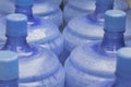 Large blue bottles of drinking water