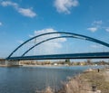 Large blue bridge in front of blue sky at the harbor