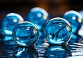 Large blue glass beads sitting. A group of blue glass balls sitting on top of a table Royalty Free Stock Photo