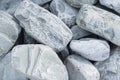Large blue-gray cobblestone for surface decoration, close-up. Natural stone texture background, top view
