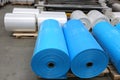 Large blue industrial plastic rolls