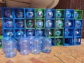 Large blue plastic water bottles in container Royalty Free Stock Photo