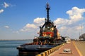 A large blue tug, a ship in sea, river port, moored near the pier. Tugboat stands in the seaport, Odessa, Ukraine. Royalty Free Stock Photo