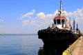 A large blue tug, a ship in sea, river port near the pier. Tugboat stands in the seaport, Odessa, Ukraine Royalty Free Stock Photo