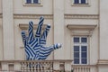 Large blue and white hand with fingers on the balcony