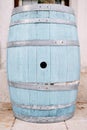 Large blue wooden barrel stands on a tile against the wall Royalty Free Stock Photo