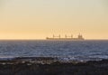 Large boat out at sea at sunset Royalty Free Stock Photo