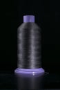 Large bobbin with thick black thread for sewing coarse fabrics and leather