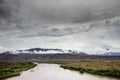 A large body of water with a mountain in the background Royalty Free Stock Photo