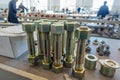 Large bolts with screwed nuts in metalworking factory