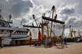 Large bottom trawling fishing nets ot Dutch cutter boat anchored in Oudenshild garbor on island Texel