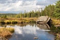 A large boulder in a river under stormy skies Royalty Free Stock Photo