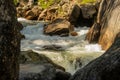 Large Boulder Stands Strong In The Current of Tuolumne River Royalty Free Stock Photo