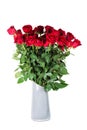 Large bouquet of beautiful vivid red roses with high stems in gray ceramic vase. Isolated on white background