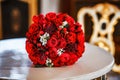 Large bouquet of red roses on the table in the banquet hall