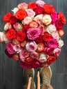 A large bouquet of roses at the girl's feet. Royalty Free Stock Photo