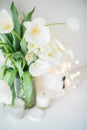 Large bouquet of white spring flowers in a vase, daffodils, tuli Royalty Free Stock Photo