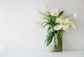 Large bouquet of white spring flowers in a vase, daffodils, tuli Royalty Free Stock Photo