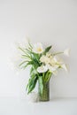 Large bouquet of white spring flowers in a vase, daffodils, tuli Royalty Free Stock Photo