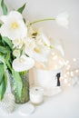 Large bouquet of white spring flowers in a vase, daffodils, tuli Royalty Free Stock Photo