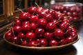 a large bowl of cherries sitting on a table Royalty Free Stock Photo