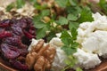 Large bowl with cottage cheese, nuts, herbs and dried berries Royalty Free Stock Photo