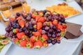 Large bowl full of red fruits rich in vitamins and antioxidants