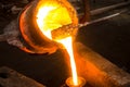 large bowl of molten metal at a steel mill. Steel production