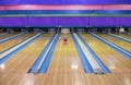 Large Bowling Alley with a ball rolling down the lane