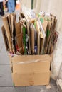 A large box of folded up cardboard boxes set outside a residence in Rome, Italy for garbage recycling pick up