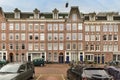 a large brick building with cars in front of it