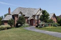 Large brick home with cedar roof Royalty Free Stock Photo