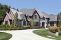 Large brick home with circular driveway Royalty Free Stock Photo