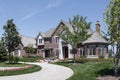 Large brick home with stone entry