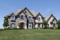 Large brick home with stone entry