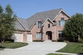 Large brick home with three car garage Royalty Free Stock Photo