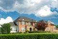 Large brick House in American suburb. Beautiful house with green lawn