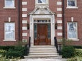 Large brick house with elegant wooden door