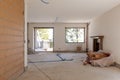 Large bright room with windows of an ancient villa undergoing renovation. The old walls have been torn down and new ones have been