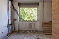 Large bright room with windows of an ancient villa undergoing renovation. The old walls have been torn down and new ones have been