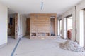 Large bright room with windows of an ancient villa undergoing renovation. The old walls have been torn down and new ones have been